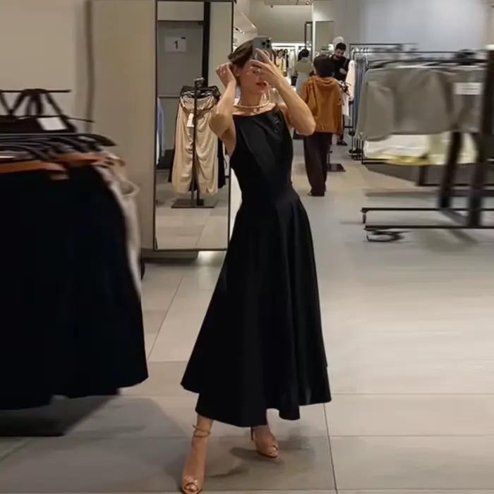 Robe midi noire pour femme, dos nu à bretelles fines, coupe trapèze évasée, sans manches, pour soiré