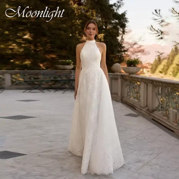 Robe de mariée élégante en dentelle, style licou, coupe trapèze, sans manches, dos nu, traîne balaya
