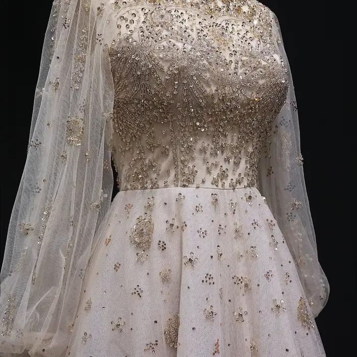 Robe de soirée de luxe Sharon Said Dubai Champagne coupe trapèze avec manches lanterne en cristal