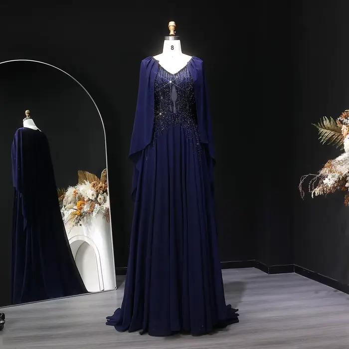 Robe de soirée Sharon Said bleu marine perlée à col en V avec cape en mousseline de soie coupe trapèze شارون سعيد