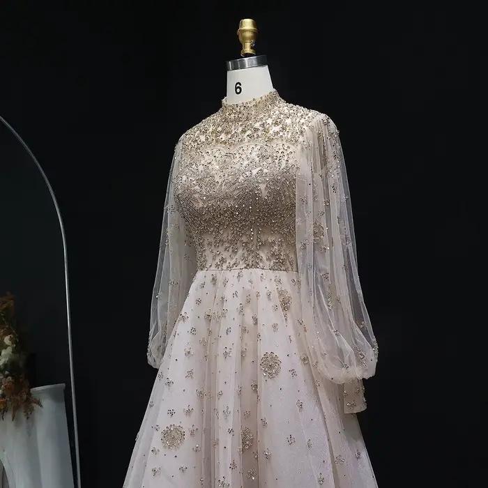 Robe de soirée de luxe Sharon Said Dubai Champagne coupe trapèze avec manches lanterne en cristal
