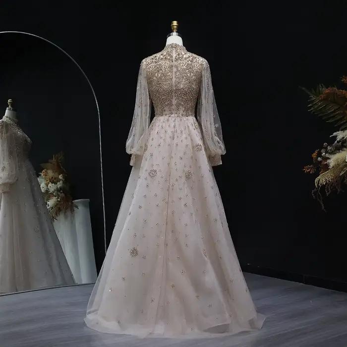 Robe de soirée de luxe Sharon Said Dubai Champagne coupe trapèze avec manches lanterne en cristal