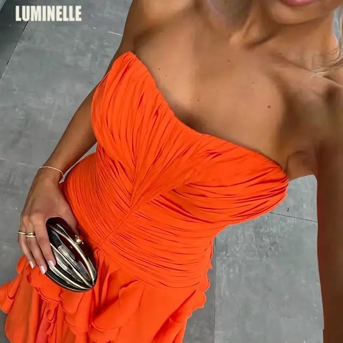 Robes de soirée orange sans bretelles en mousseline de soie à volants