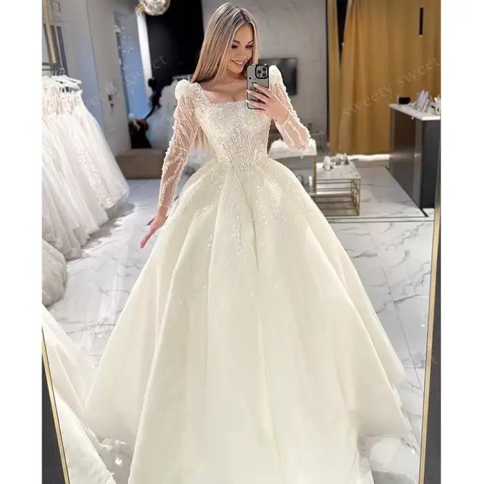 Robe de Mariée ShaLaYIi Trapèze Luxe Brodée Perles Manches Longues Col Carré Train Couronne Occasions Spéciales