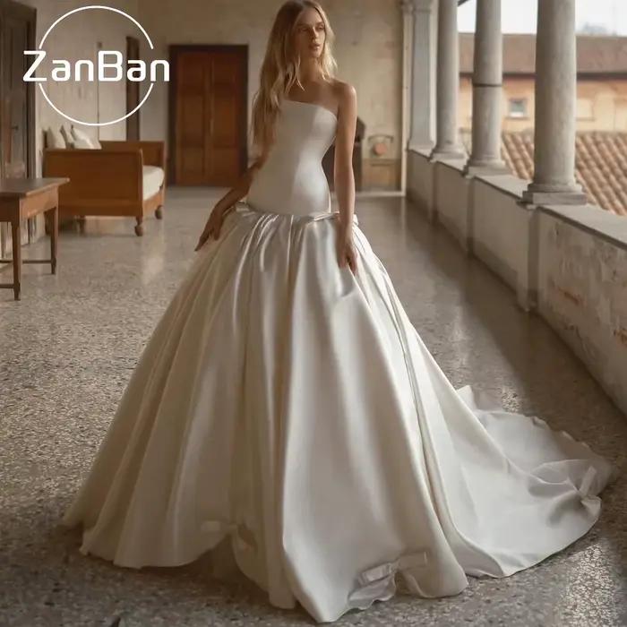 Robe de mariée moderne ZanBan personnalisée ivoire sans bretelles avec nœud 2026