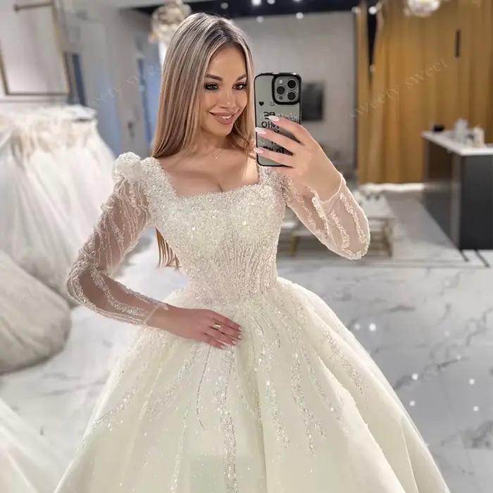 Robe de Mariée ShaLaYIi Trapèze Luxe Brodée Perles Manches Longues Col Carré Train Couronne Occasions Spéciales