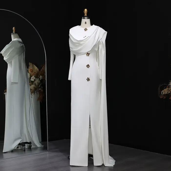 Robe de soirée sirène blanche arabe Sharon Said 2026, style Dubaï, avec cape et manches longues, pou