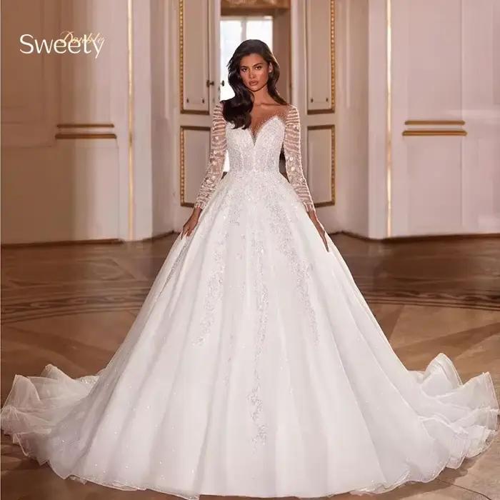 Robe De mariée luxueuse en dentelle brodée sur filet avec paillettes, col rond, manches longues, bou