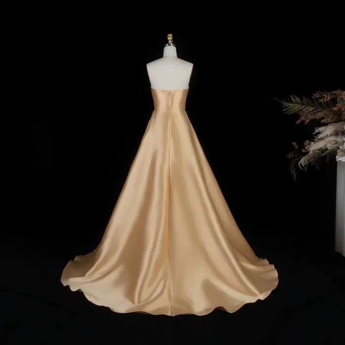 Robe de soirée trapèze sans bretelles Sharon Said Dubai Luxury Gold avec gants perlés شارون سعيد