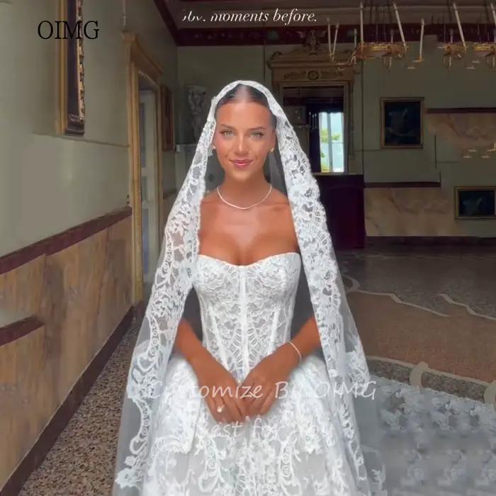 Robe de mariée OIMG en polyester avec train de balayage dos nu élégante pour cérémonies modernes et traditions contemporaines