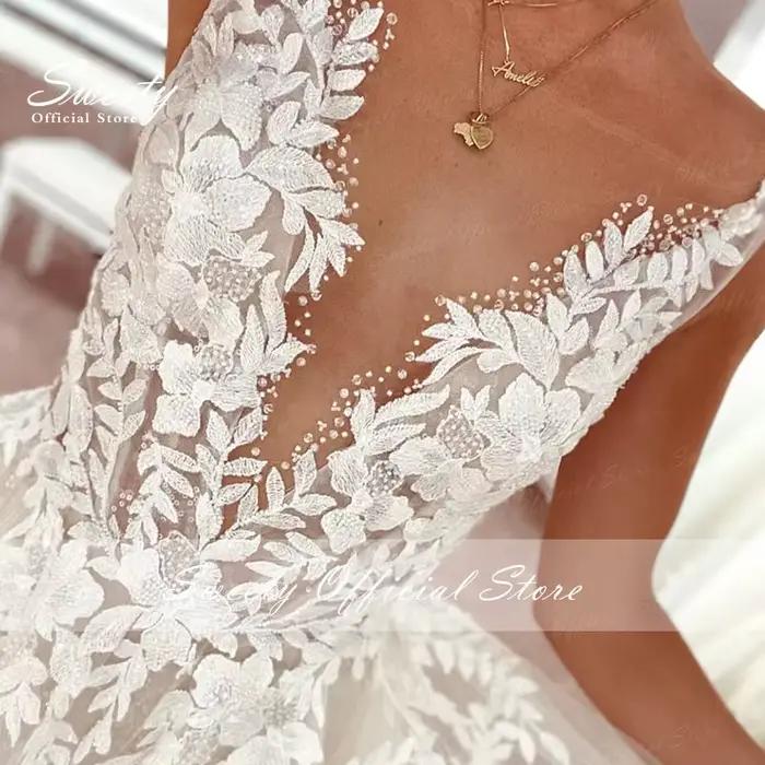 Robe de mariée en organza avec perles brodées