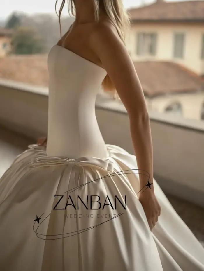 Robe de mariée moderne ZanBan personnalisée ivoire sans bretelles avec nœud 2026